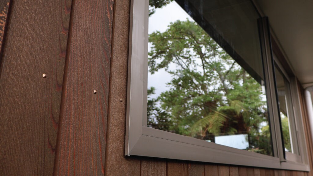 nz aluminium joinery kitchen sliding window Frost Ultra Champagne 25 Micron Residential Suite colour cedar cladding